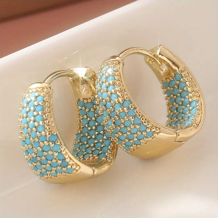 Orecchini a cerchio con perline turchesi color oro | Oro
